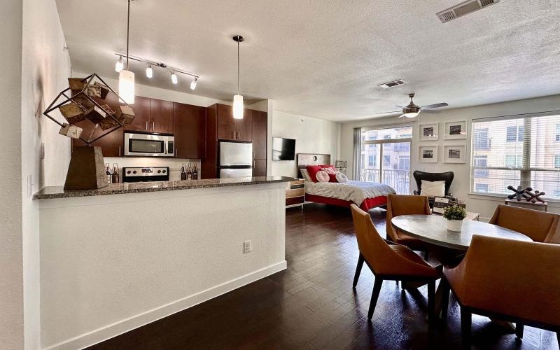 a large kitchen with a couch and a table