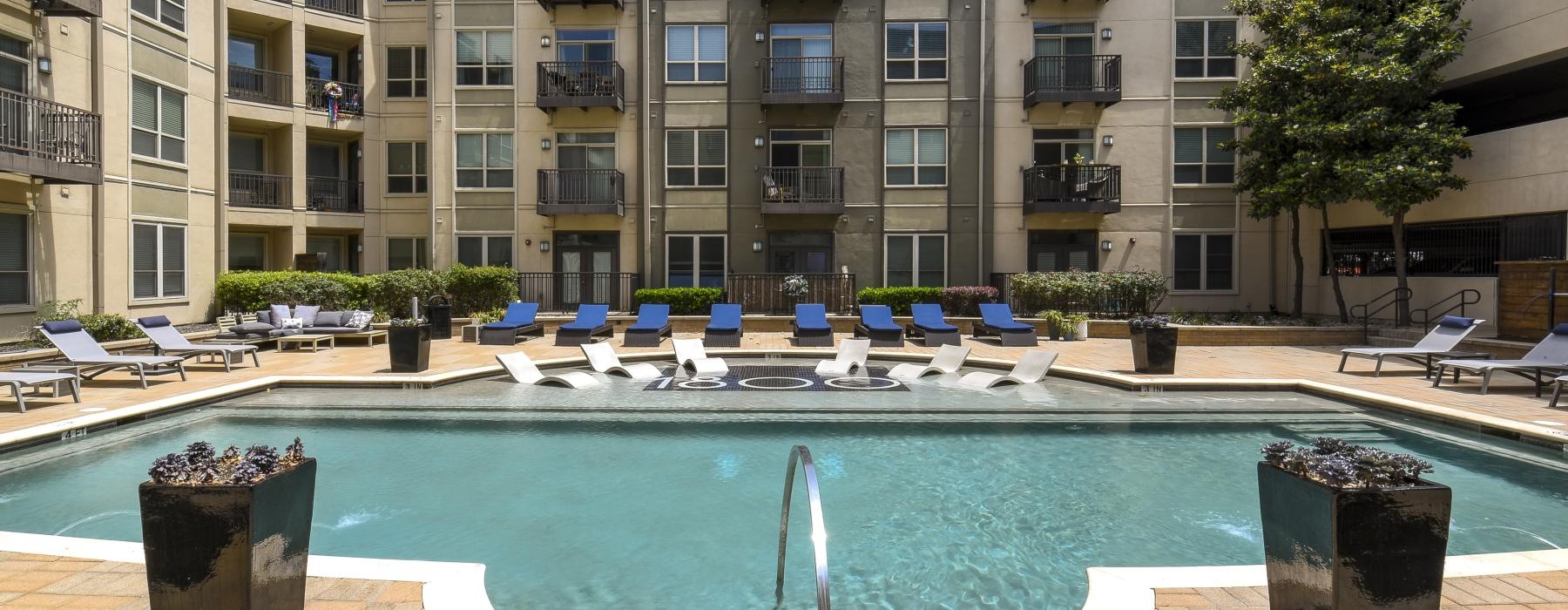 a pool in front of a building